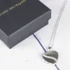 Bijoux personnalis&eacute;s: Pendentif c&oelig;ur en argent grav&eacute; pour 2 photos