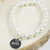 Bijoux personnalis&eacute;s: Bracelet de perles avec m&eacute;daille en argent grav&eacute;e